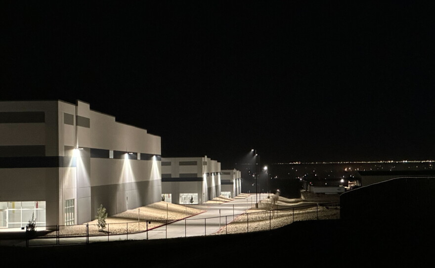 A massive 826,780-square-foot warehouse sits illuminated Feb. 12, 2026, in the El Paso suburb of Socorro, Texas, that was recently purchased by the U.S. Department of Homeland Security for $122.8 million.