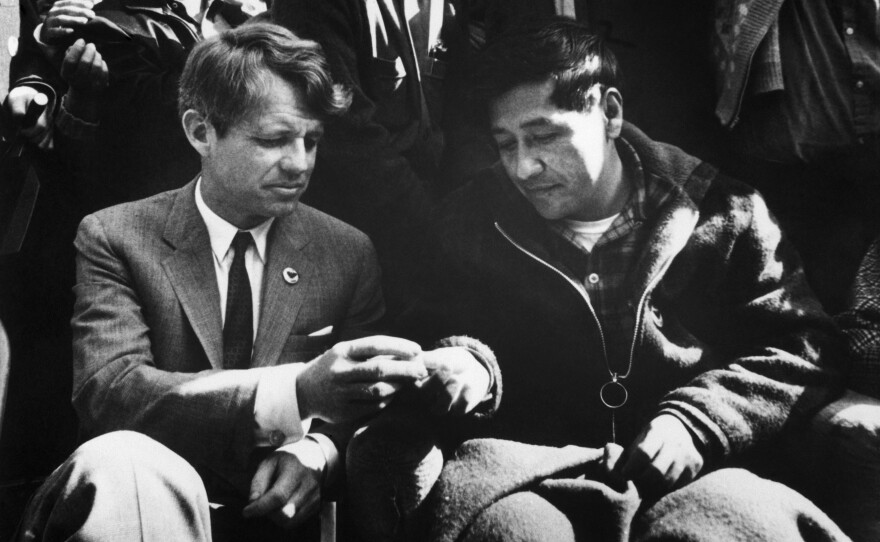 Sen. Robert F. Kennedy shares bread with Chavez on March 10, 1968, as the union leader ends a 25-day fast in support of nonviolence in the strike against grape growers.