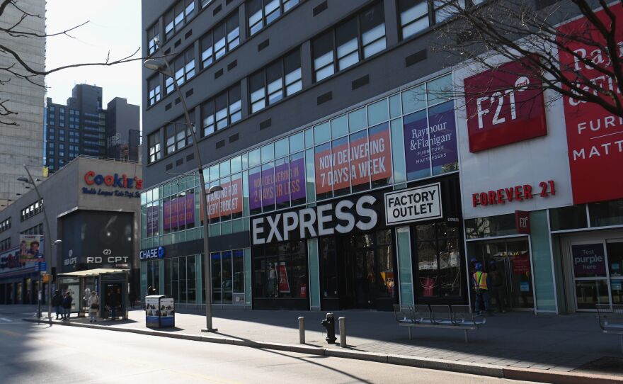 A nearly empty Fulton Street Mall on Monday in Brooklyn. Many more businesses and schools across the U.S. closed in the wake of the coronavirus spread.
