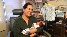 Ana Perez holds her daughter Carina in the neonatal intensive care unit at UCSD Medical Center in Hillcrest. Carina was born 12 weeks early. 