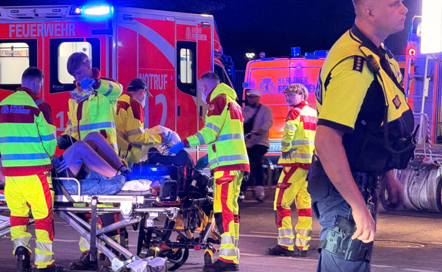 Emergency personnel tend to a person on a stretcher following the cancellation of Christopher Street Day in Berlin on Saturday, July 25, 2026.