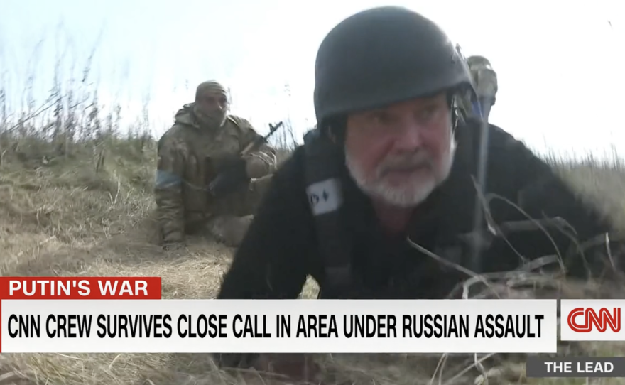 CNN's Ben Wedeman ducks for cover while reporting in Ukraine in 2022.