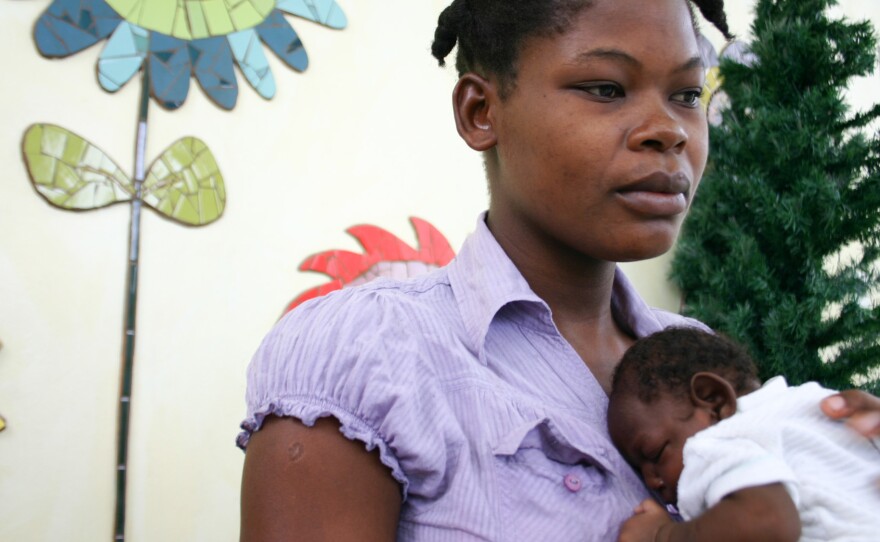 Maudeline Orelien, 22, with her son, Wilguens Pierre, who was born in July with microcephaly.