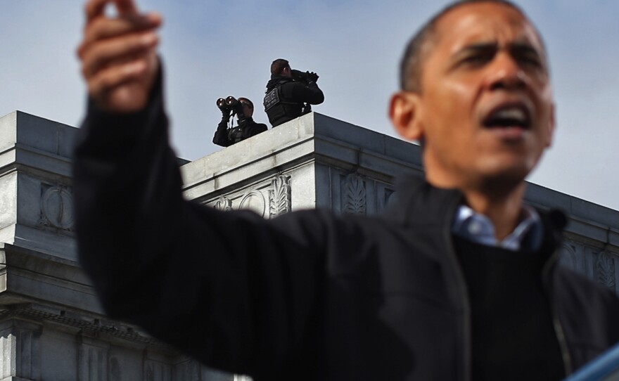 A Secret Service counter-sniper team looks out on State Capitol Square and the surrounding area as President Obama addresses a campaign rally on Nov. 4, 2012, in Concord, N.H.