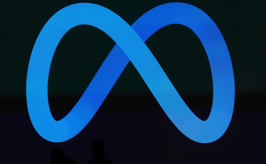 A Meta logo is shown on a video screen at LlamaCon 2025, an AI developer conference, in Menlo Park, Calif., April 29, 2025.