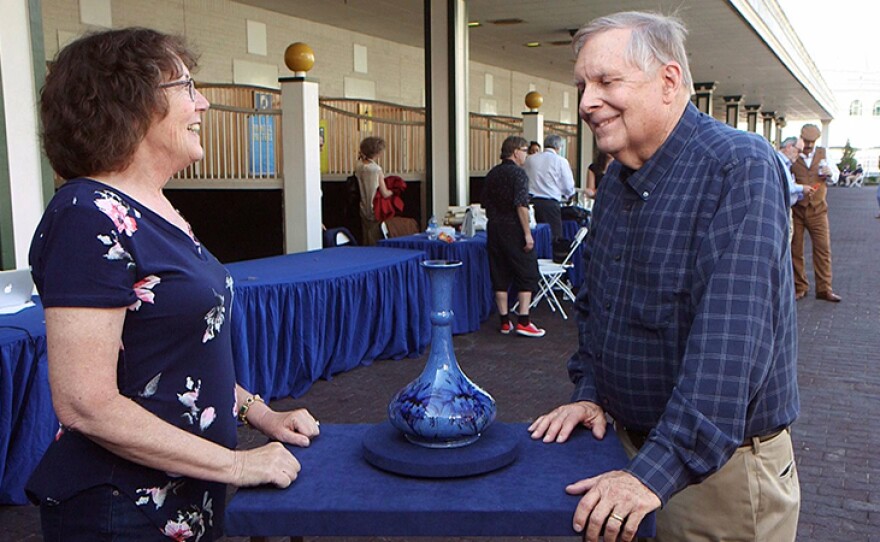 Riley Humler (right) appraises a Moorcroft cornflower vase, ca. 1935 at Churchill Downs Racetrack in Louisville, Ky.