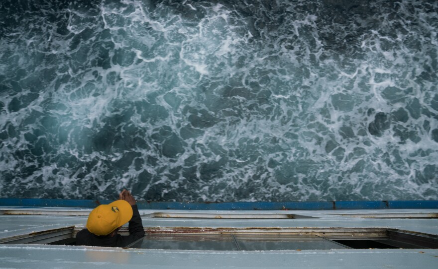 A man stares out at the water as the ferry traverses the nearly 50 miles between stops.