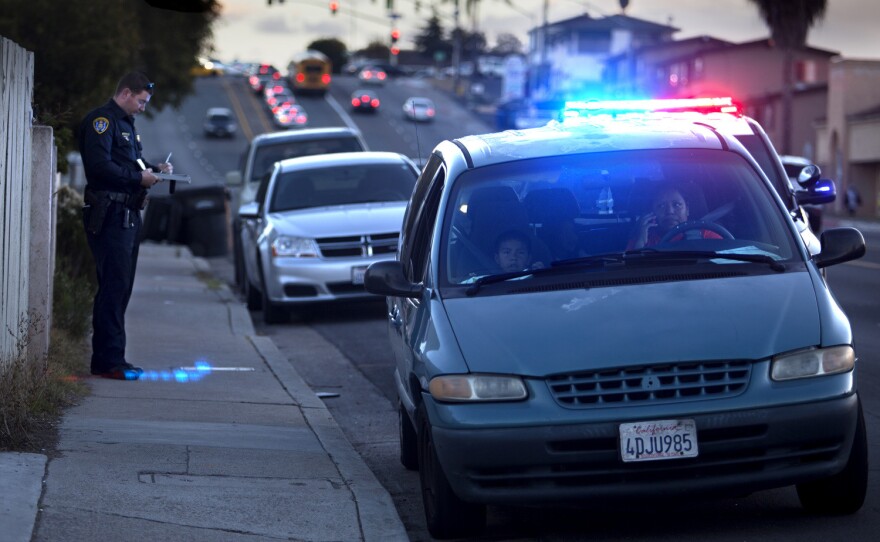 A San Diego police officer pulls over a driver in Valencia Park in this undated photo.