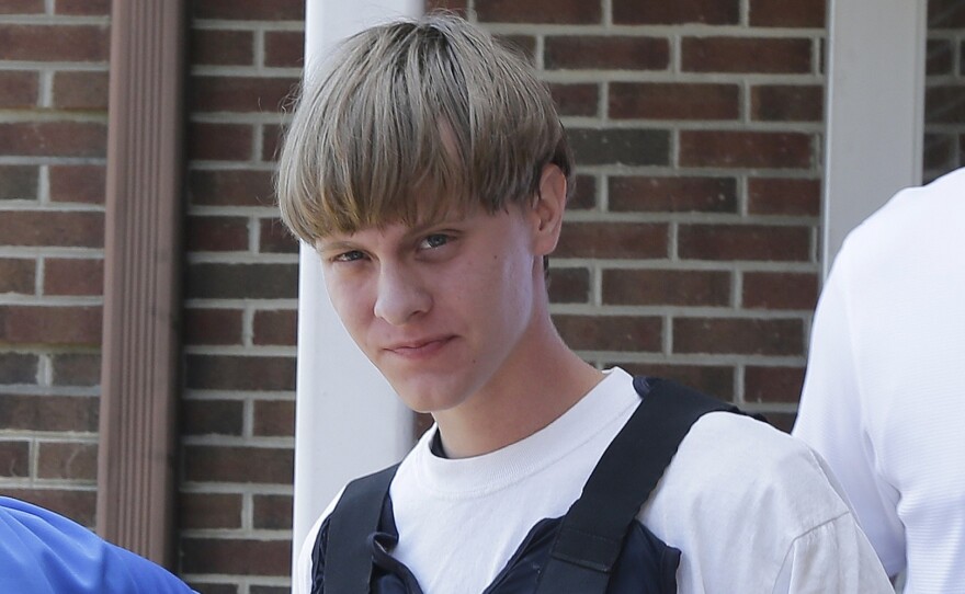 Dylann Roof is escorted from the Shelby Police Department in Shelby, N.C., on June 18, 2015.