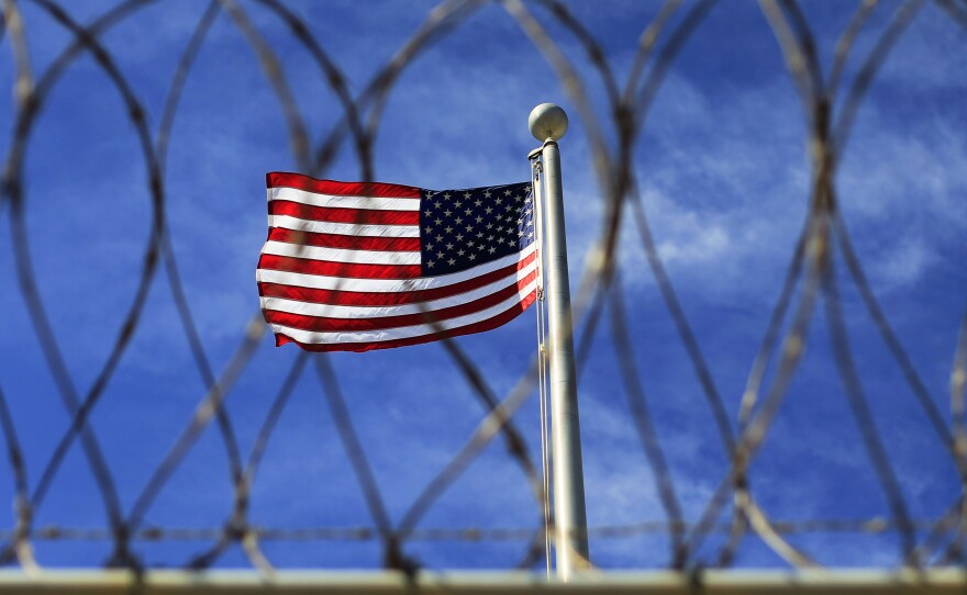An American flag flying over Camp VI, where detainees are housed at the U.S. Naval Base at Guantanamo Bay.