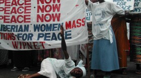 Liberian women demonstrate at the American Embassy in Monrovia at the height of the civil war, 2003.