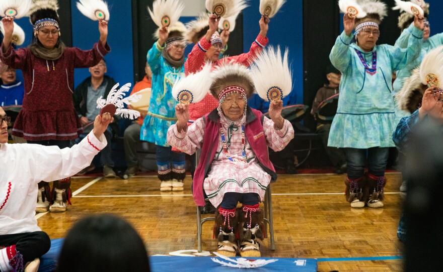 Lizzie Chimiugak Nenguryarr (center), the first person counted for the 2020 census, joins in the Yup'ik dancing at the ceremony on Tuesday.