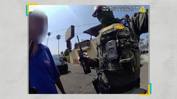 An immigration agent arrests a worker at the Hand J car wash in Los Angeles during a raid in August 2025.