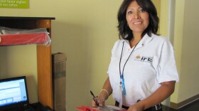 Celia Martinez has been hired by the Mexican electoral agency to register Mexican expats to vote in the next election. Helpers like her are stationed in Mexican consulates in 30 U.S. cities until Jan. 15.