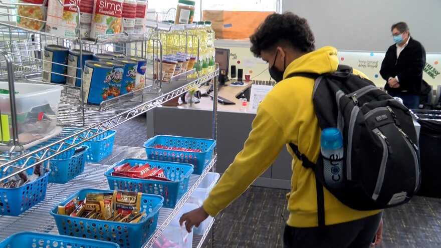 Alex Montes shops at The Stand basic needs resource center at Mesa College, San Diego, CA, November 18, 2021