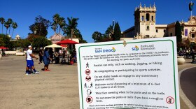 A coronavirus safety advisory sign at the Plaza de Panama in Balboa Park on Aug. 30, 2020.