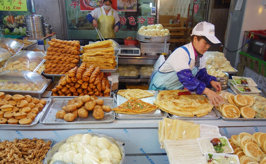 A food stall in South Korea's Wongok Village sells Chinese flatbreads and other snacks popular in China. Two-thirds of Wongok's residents are not ethnically Korean, and many of them are from China.