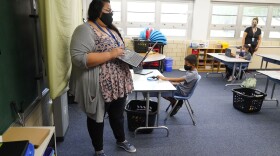 Teacher Jessica Flores directs students as they work on laptops in a classroom in Newlon Elementary School early Tuesday, Aug. 25, 2020. 
