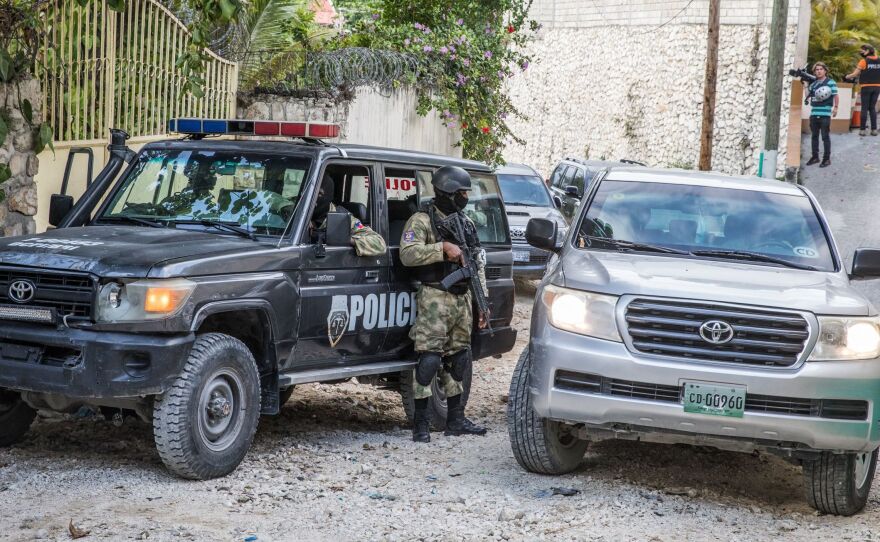 Police stand guard outside the residence of the late Haitian President Jovenel Moïse in Port-au-Prince on July 15 in the wake of his assassination on July 7.