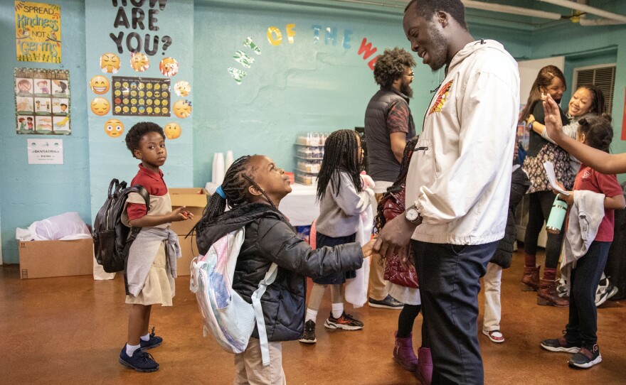 Director of Diversity, Equity and Inclusion Isaac James greets children at the Memphis Refugee Empowerment Program on Feb. 15.