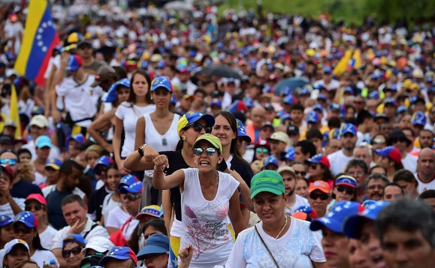 People demonstrate against the government of Venezuelan President Nicolas Maduro in Caracas on Wednesday.