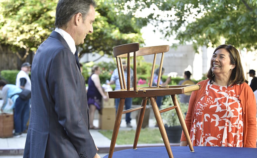 Peter Loughrey (left) appraises a George Nakashima grass seat chair, ca. 1965 at Crocker Art Museum.