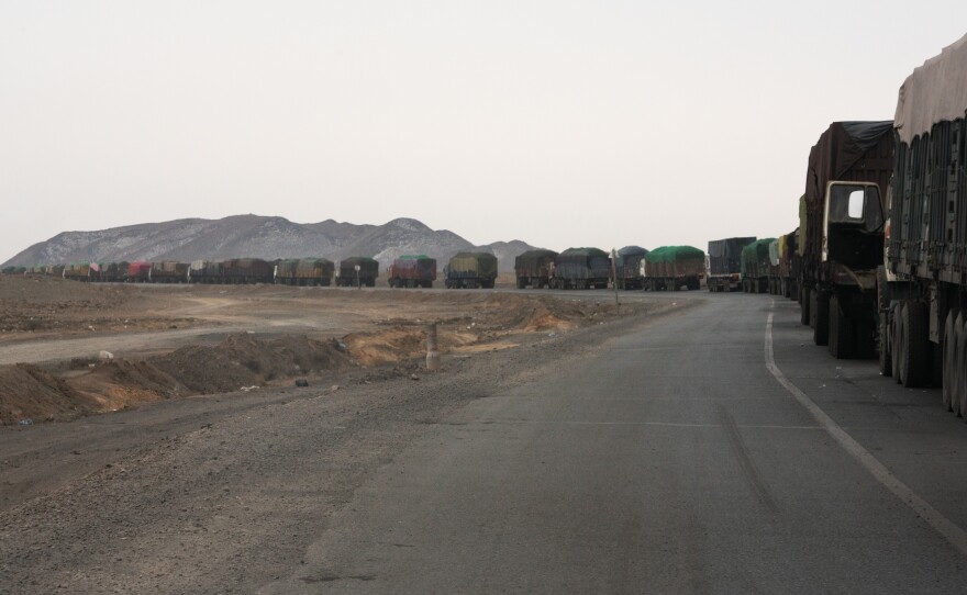 The road from Mongolia's Tavan Tolgoi coal mine to the border crossing at Gashuun Sukhait is 150 miles long. Backups can stretch for miles. Drivers may wait up to seven days in this line before reaching China.