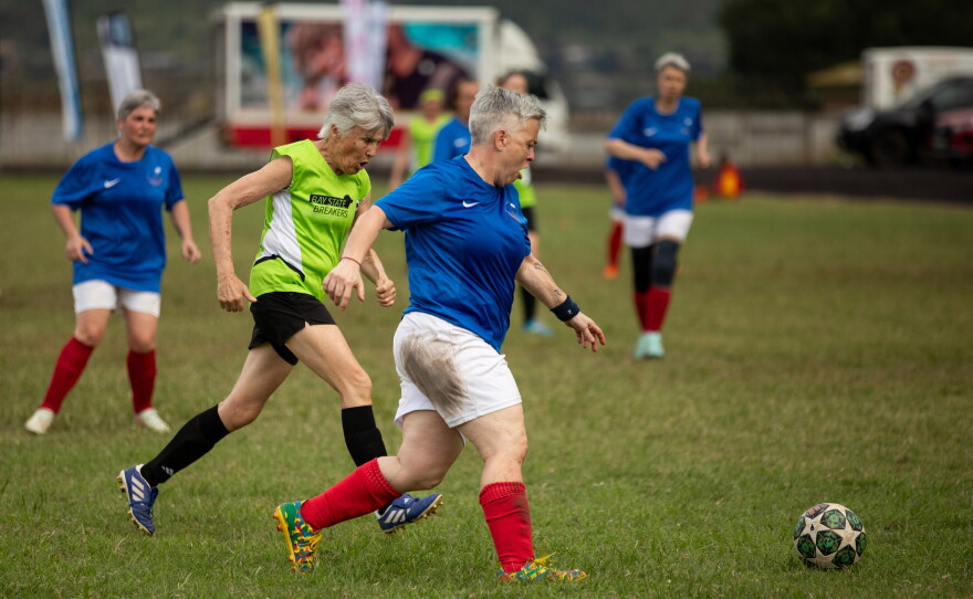 Laurance Gonzalez, 58, a player on the French team Les Zamies Foot, shows off her footwork. Gonzalez (pictured above in the foreground, wearing blue and white) won the award for best overall player at the tournament.