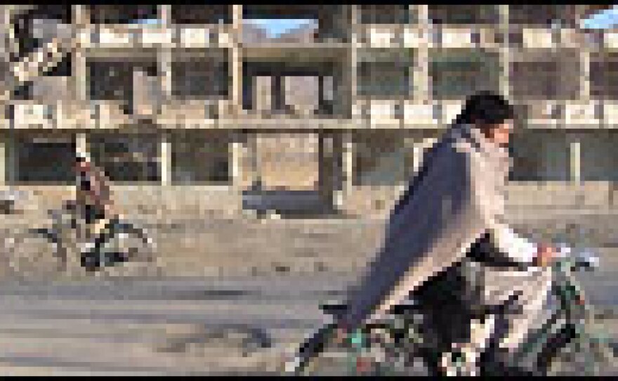 Biking through the destruction.