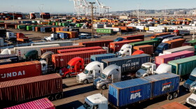 Trucks line up to enter a Port of Oakland shipping terminal in Oakland on Nov. 10, 2021.