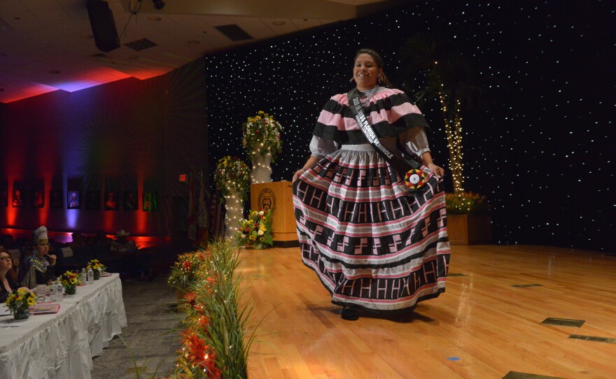 Skyla Osceola, 16, wears a striking hand-made cotton traditional patchwork dress with Man on Horse and H symbols, which she made with the help of her mother, Francine Osceola. Skyla won the Jr. Miss Florida Seminole Princess crown.