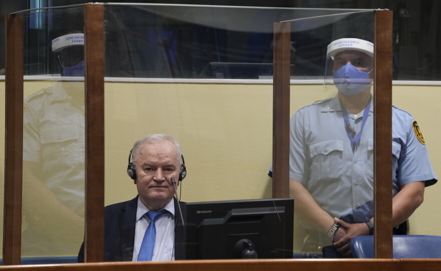 Former Bosnian Serb military chief Ratko Mladic sits in the court room in The Hague, Netherlands, June 8, 2021, where the United Nations court delivers its verdict in the appeal of Mladic against his convictions for genocide and other crimes and his life sentence for masterminding atrocities throughout the Bosnian war.