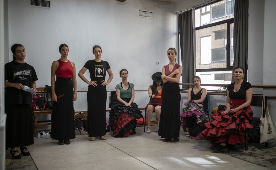 Students listen to Carmen attentively as she gives final instructions for their upcoming showcase.