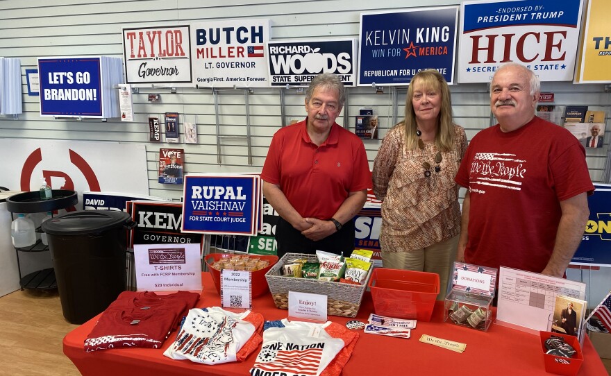 Jerry Marinich (right), the Forsyth County, Ga., Republican Party chairman, poses at the party headquarters with Bea Wilson and Ed Murray, two recently trained poll watchers.