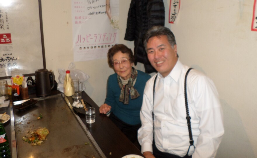 Kikue Takagi, left, narrowly survived the Hiroshima atomic bombing as a schoolgirl. She's now 83. Her second cousin is U.S. Rep. Mark Takano, a Democrat from southern California. His grandparents and parents were all placed in U.S. internment camps in World War II. In this photo from last year, they are at a restaurant in Hiroshima, where he visited her.