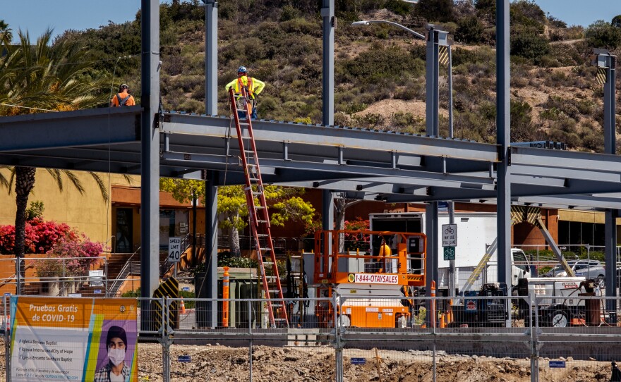 Construction workers build a future Live Well Center in Chollas View, April 19, 2022.