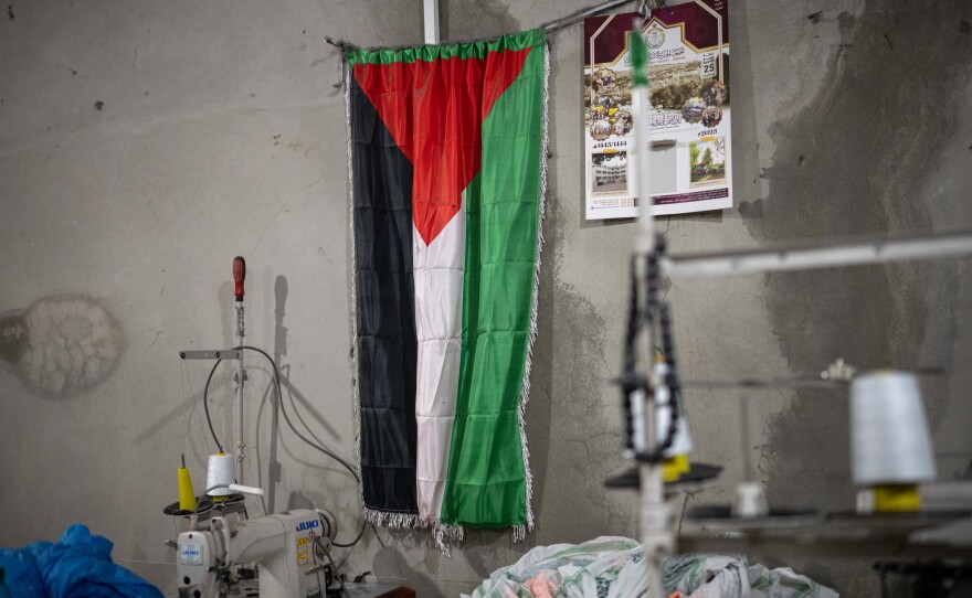 A Palestinian flag hangs on the wall of the Hirbawi factory.