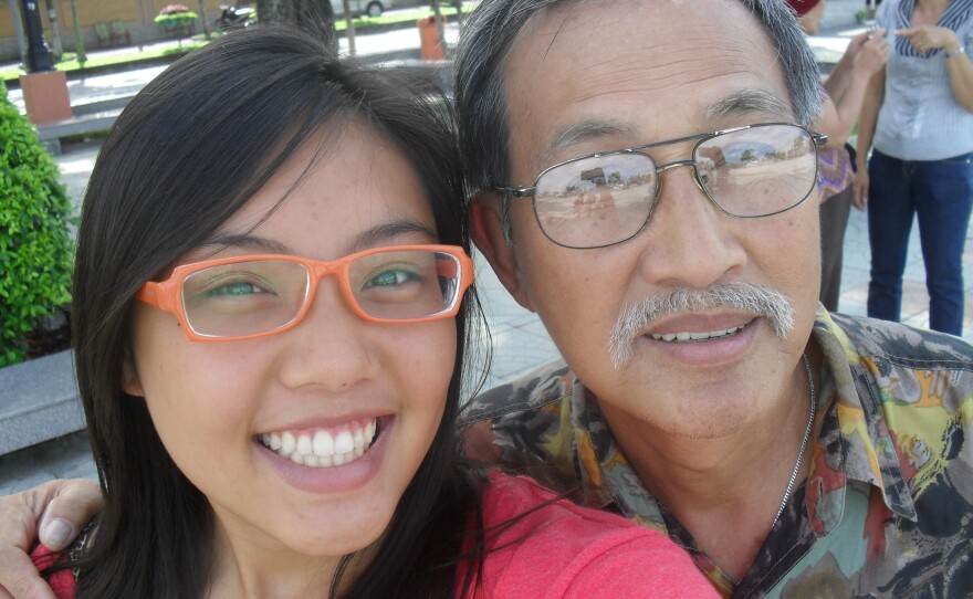 Tien Dang takes a selfie with her father, Nam.
