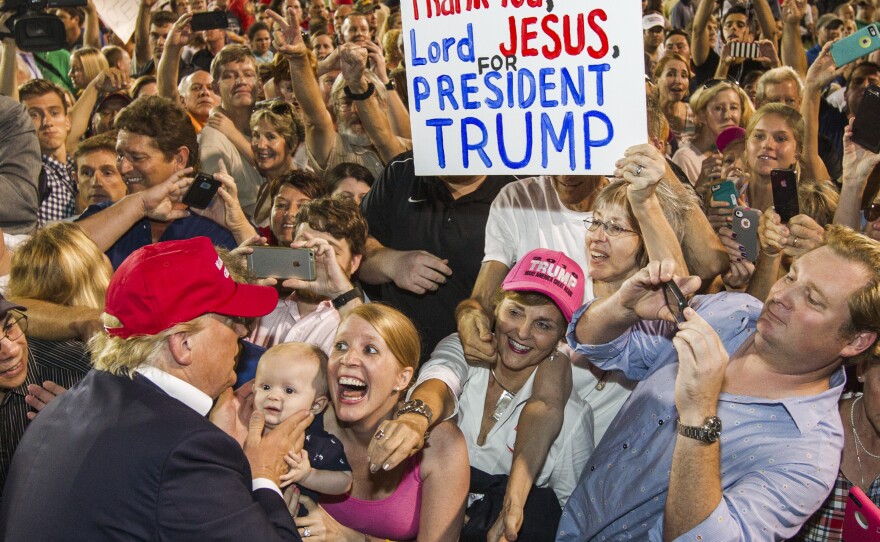 Enthusiastic supporters greet Donald Trump at a rally of more than 30,000 in Mobile, Ala., in August.