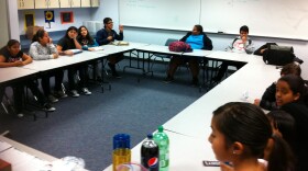 Students attend an AjA Project photography class at Monroe Clark Middle School in March 2012.