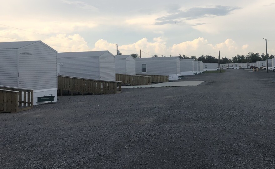 FEMA trailers set up on a gravel lot south of Houma provide shelter for people displaced by Hurricane Ida, including residents of a public housing complex that was condemned.