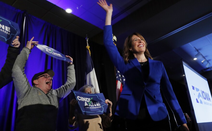 Cindy Axne, an Iowa Democrat, waves to the crowd after winning Iowa's 3rd Congressional District.