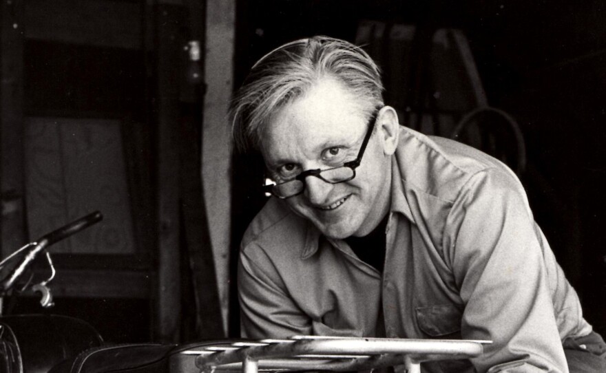 Author Robert Pirsig works on a motorcycle in 1975.