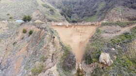 In this March 24, 2021, photo provided by the California Department of Transportation, Caltrans construction crews repair a section of Highway 1, along Big Sur, Calif., that was washed away during a winter storm. 