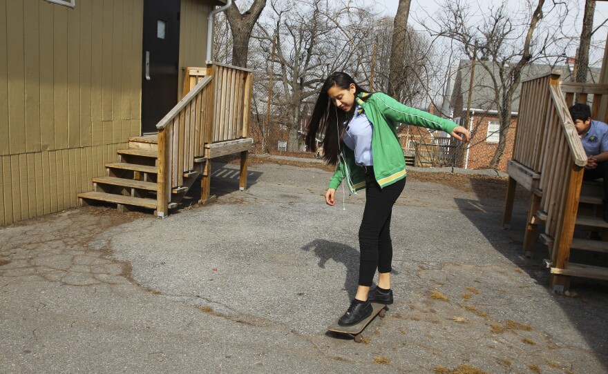Junior Nury Sola, 16, shows off her skateboard skills during lunch period.