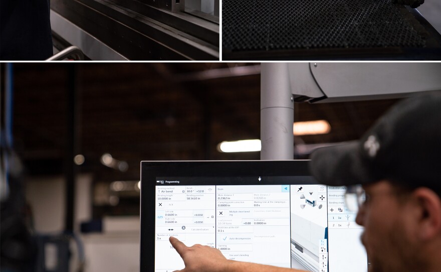 Bryan Roloff navigates a computer system to set up a machine that precisely bends steel in Marlin Steel's Baltimore factory.