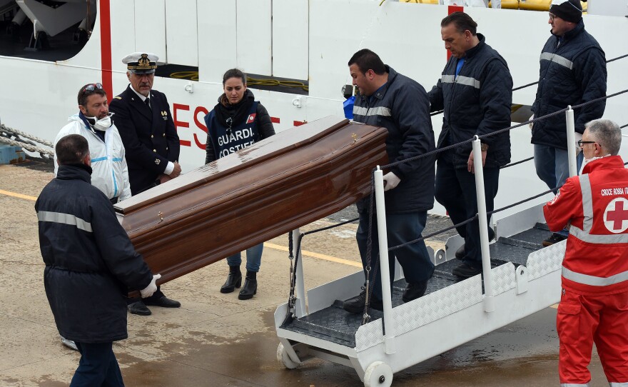 Men carry a coffin during the arrival of migrants and refugees in the port of Messina following a rescue operation at sea by the Italian Coast Guard ship "Diciotti" on March 17 in Sicily. After several quiet weeks, March saw a pickup in the flow of migrants attempting to reach Italy via Libya, a route through which about 330,000 people have made it to Europe since the start of 2014.