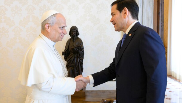 Pope Leo XIV greets U.S. Secretary of State Marco Rubio, right, upon his arrival for talks in the pope's private library at the Vatican.