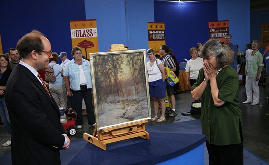 Alan Fausel (left) appraises a Walter Launt Palmer oil painting, ca. 1900, in Baltimore, Md. ANTIQUES ROADSHOW “Vintage Baltimore 2021, Hour 2” premieres Monday, January 18 at 8/7C PM on PBS.