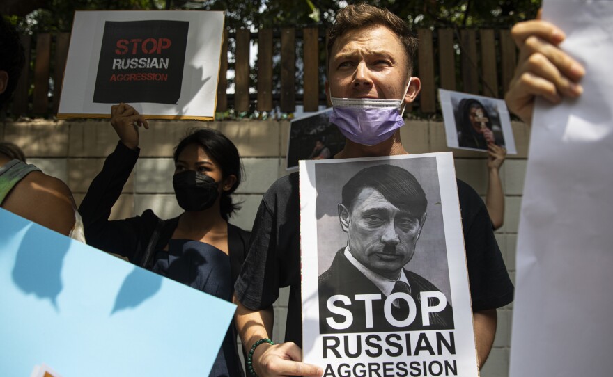 Protesters rallied outside the Russian Embassy in Bangkok, Thailand on Friday, after Russian forces invaded Ukraine.